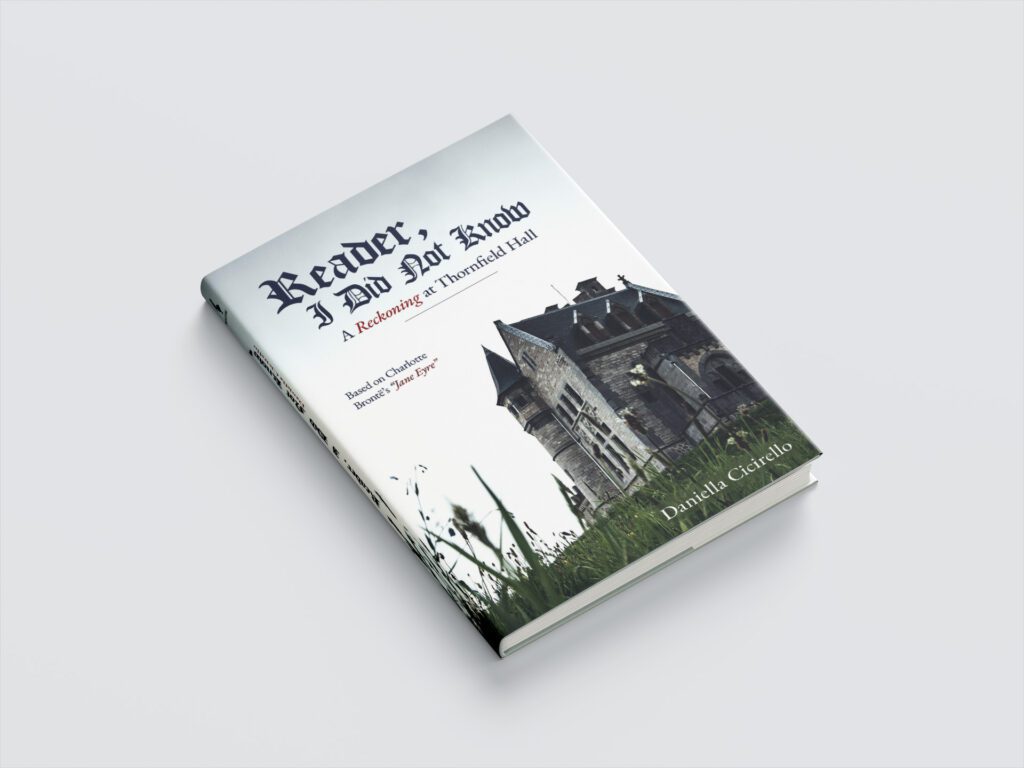 Reader, I Did Not Know book cover with a shot looking upward at a beige and grey castle on a cloudy day in a grassy field. The title has blackletter typography and serif fonts in dark blue and pops of red.