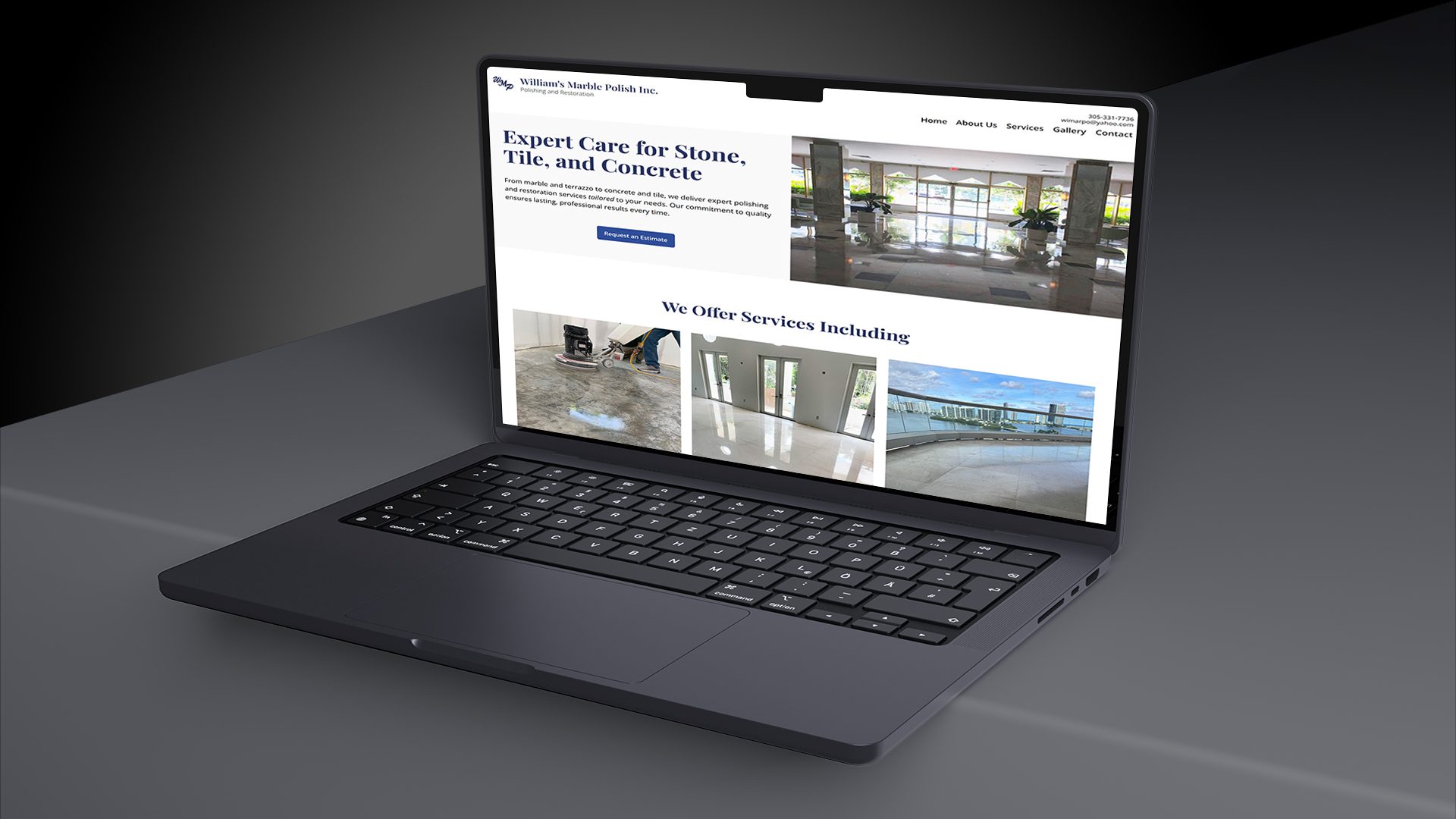 Black laptop on black table and background with William's Marble Polish Inc website featured home page.